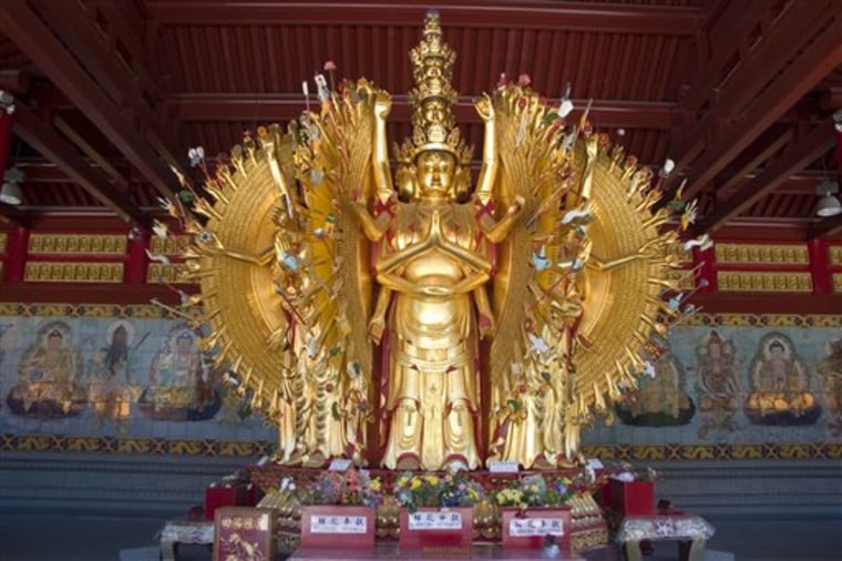 This photo released by Tourism British Columbia shows a golden Buddha statue at the International Buddhist Temple in Richmond, British Columbia.